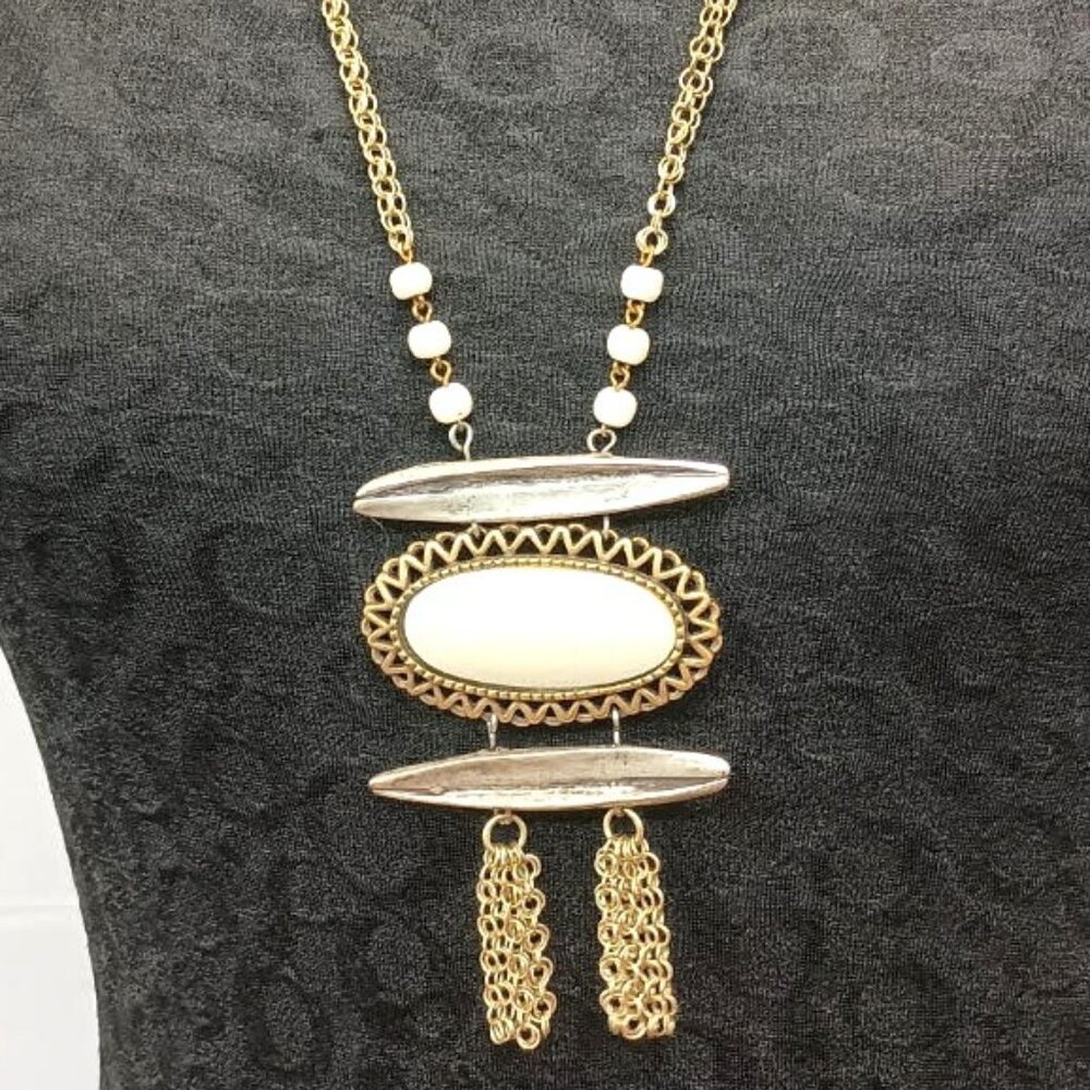 Ferrara Whiting and Davis Antique Brass Plated Ring Mesh with Faux bone pendant